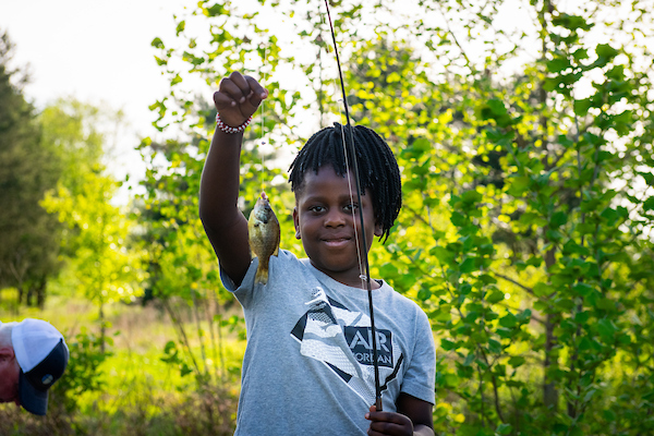 CHILD WITH FISH